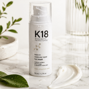 K18 Leave-In Molecular Repair Hair Mask on white marble surface